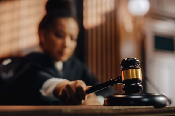 Court of Law Trial in Session Honorable Female Judge Pronouncing Sentence striking Gavel Focus on Mallet Hammer Cinematic Shot of Dramatic Not Guilty Verdict Close-up Shot - Derfel